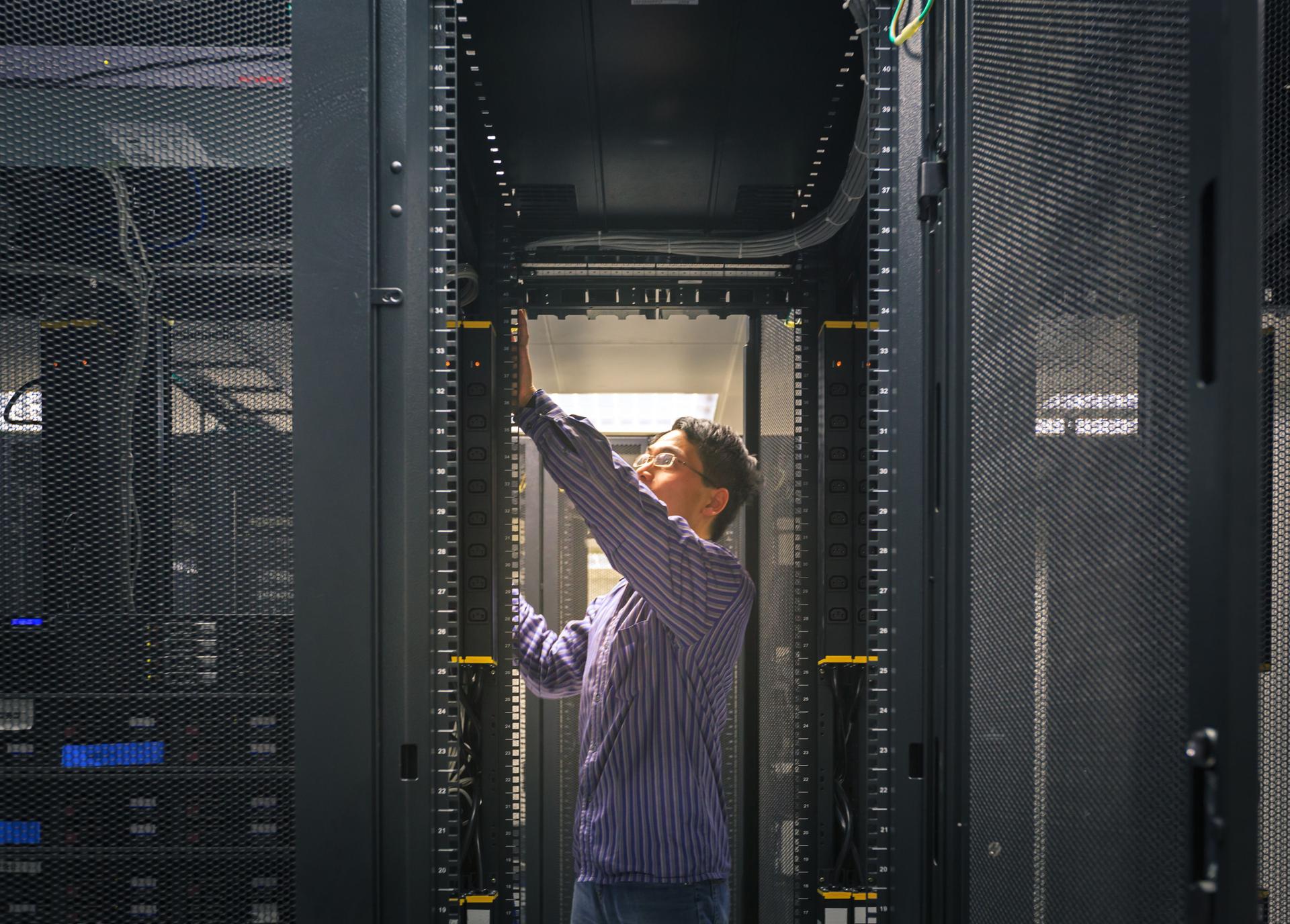 Administrator working on a server room